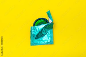 A picture of a condom in a blur wrapper against a yellow background in a blog post about 10 GUARANTEED CONTRACEPTION METHODS FOR YOU IN 2023